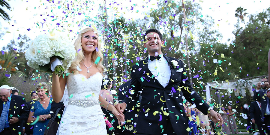 Wedding couple under confetti