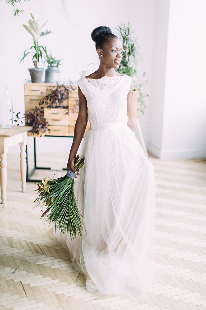 Bride standing with bouquet